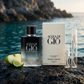 Armani Acqua di Giò Eau de Parfum Intense bottle and box with plain clear-glass travel sprays in a dramatic coastal setting