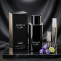 Armani Code Parfum bottle and box with plain clear-glass travel sprays in a black-and-silver setting