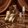 Billie Eilish Eilish No. 1 with plain clear-glass travel sprays in a warm bronze and cocoa setting