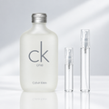 Calvin Klein CK One EDT bottle with 5 ml and 10 ml plain clear travel spray vials