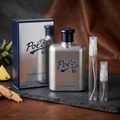 Polo 67 Extreme with clear-glass travel sprays in a luxury charcoal-and-leather setting